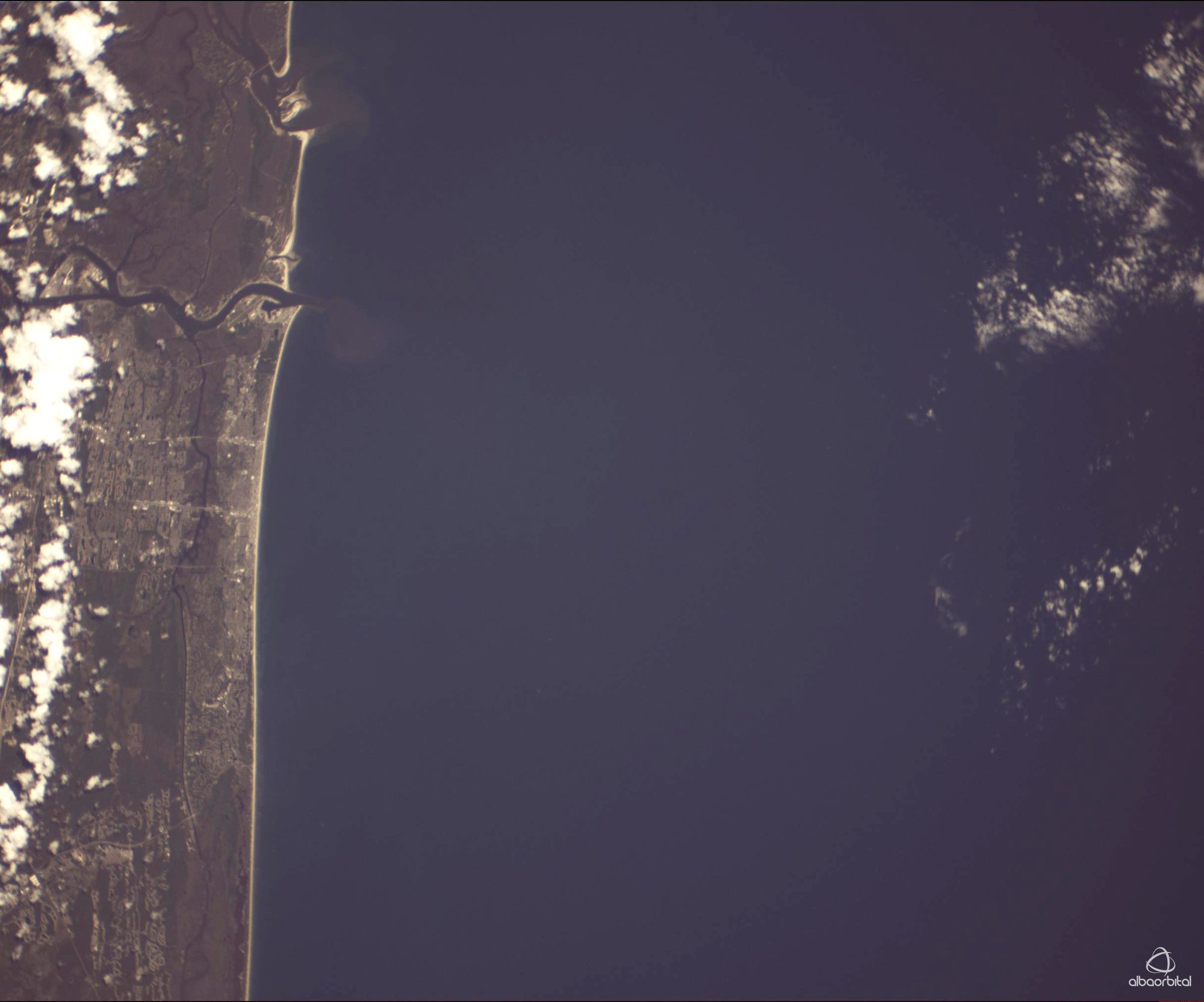 A sandy shoreline photographed from orbit
